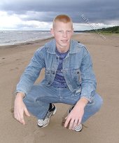 Muscly redheaded twink posing by the river